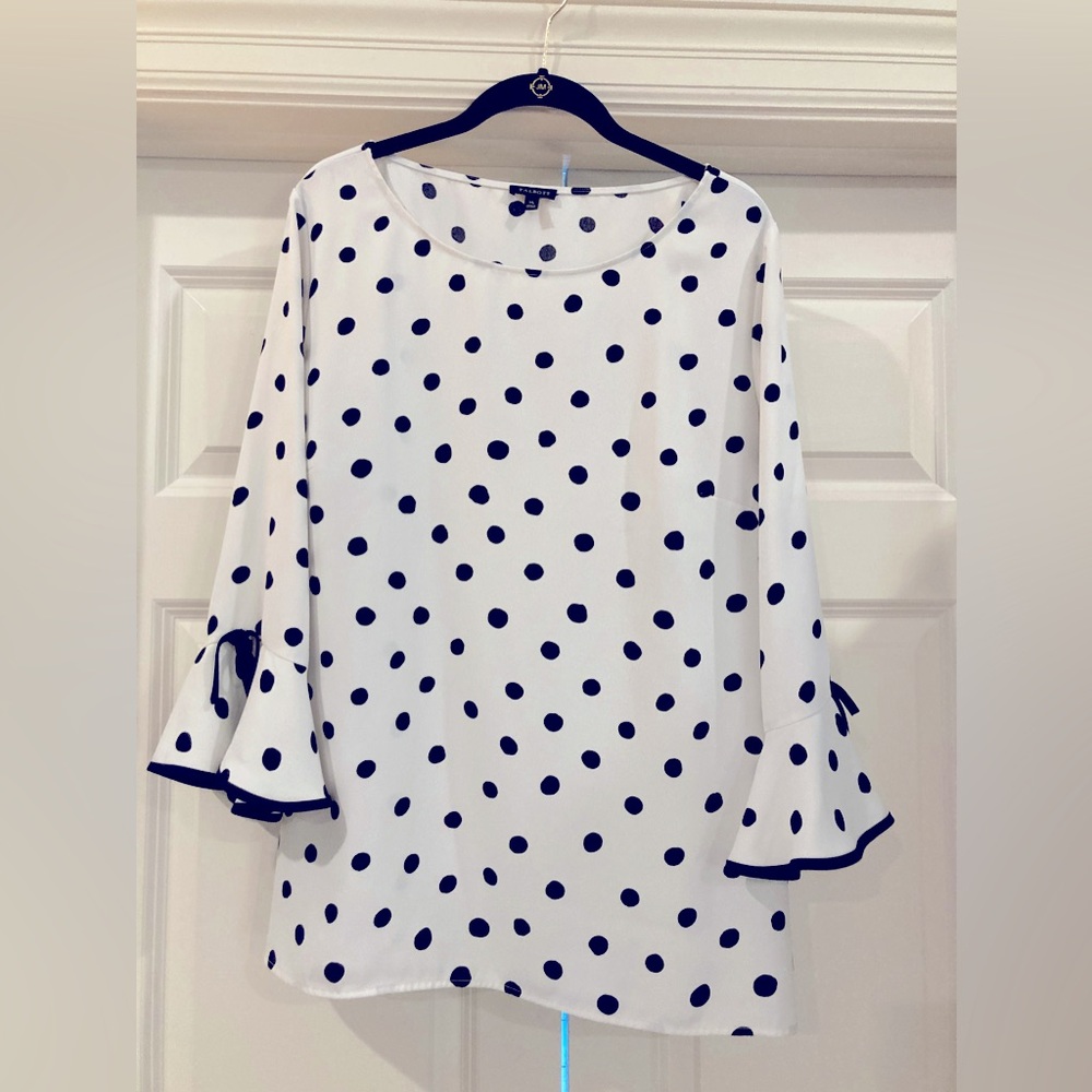 Ann Taylor pullover blouse with polka dots and black trim on ivory